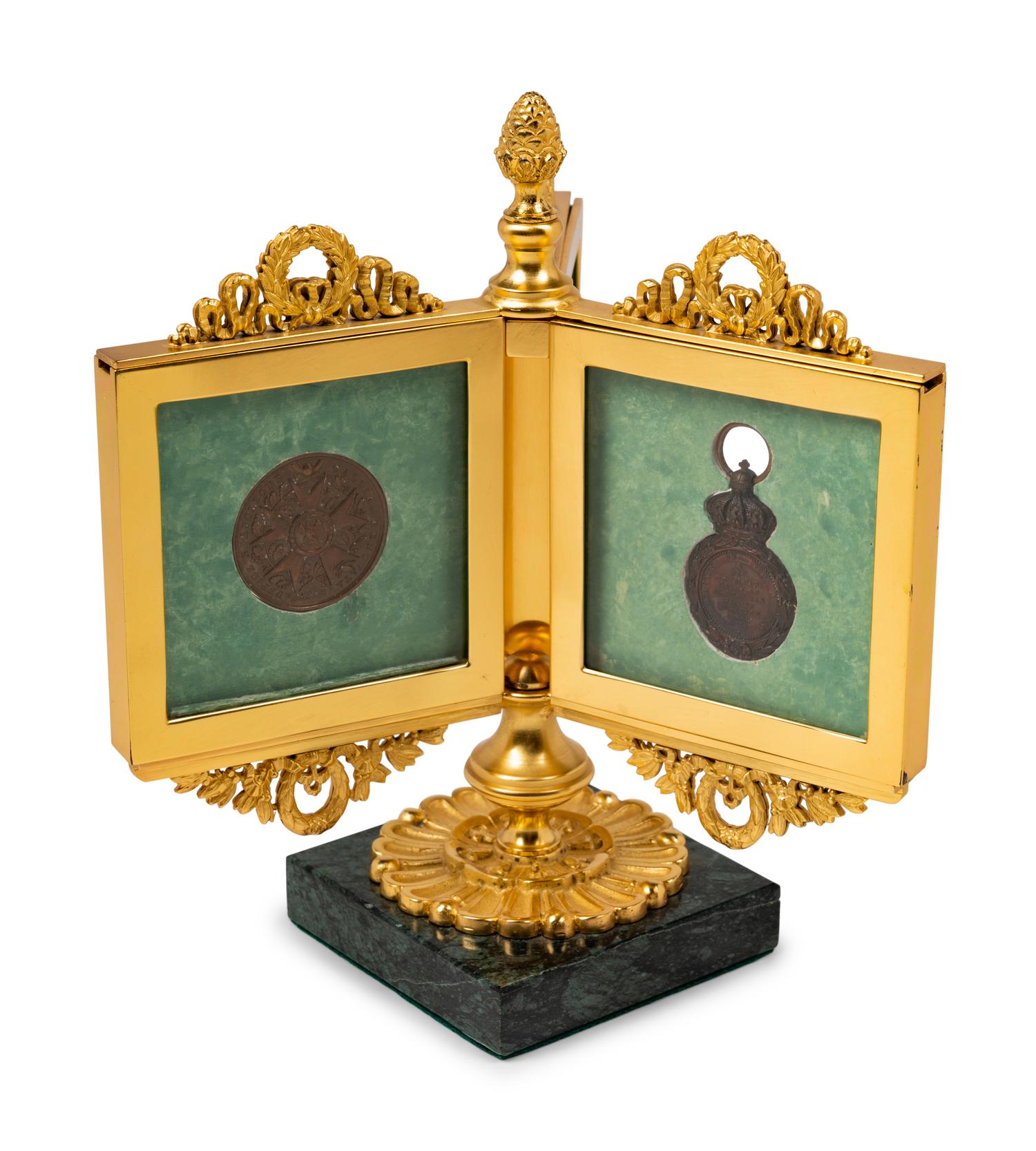 An Empire Style Gilt Bronze Tripartite Frame on Stand
