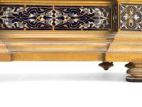 A French Gilt Bronze and Enamel Clock Garniture