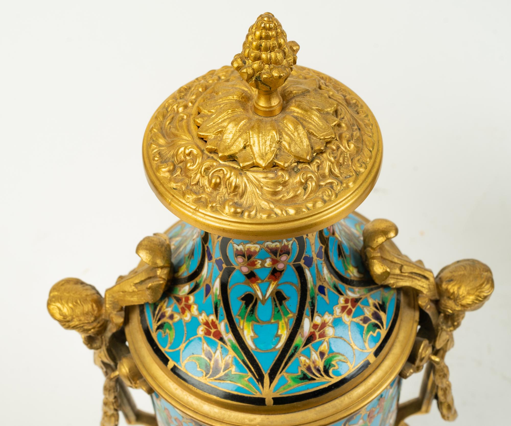 A Pair of French Gilt Bronze and Champleve Covered Urns — 19TH CENTURY