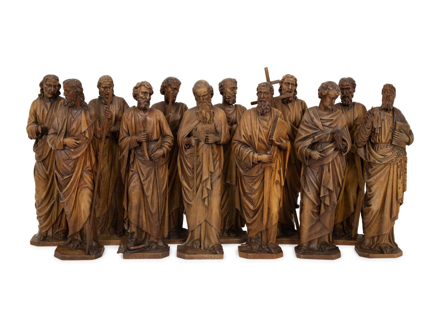 A Set of Twelve Continental Carved Walnut Figures of Apostles