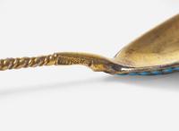 A cased set of six Russian silver gilt and shaded enamel spoons, maker's mark indistinct, Assay master Anatoly Apollonovich Artsybashev, Moscow, 1894