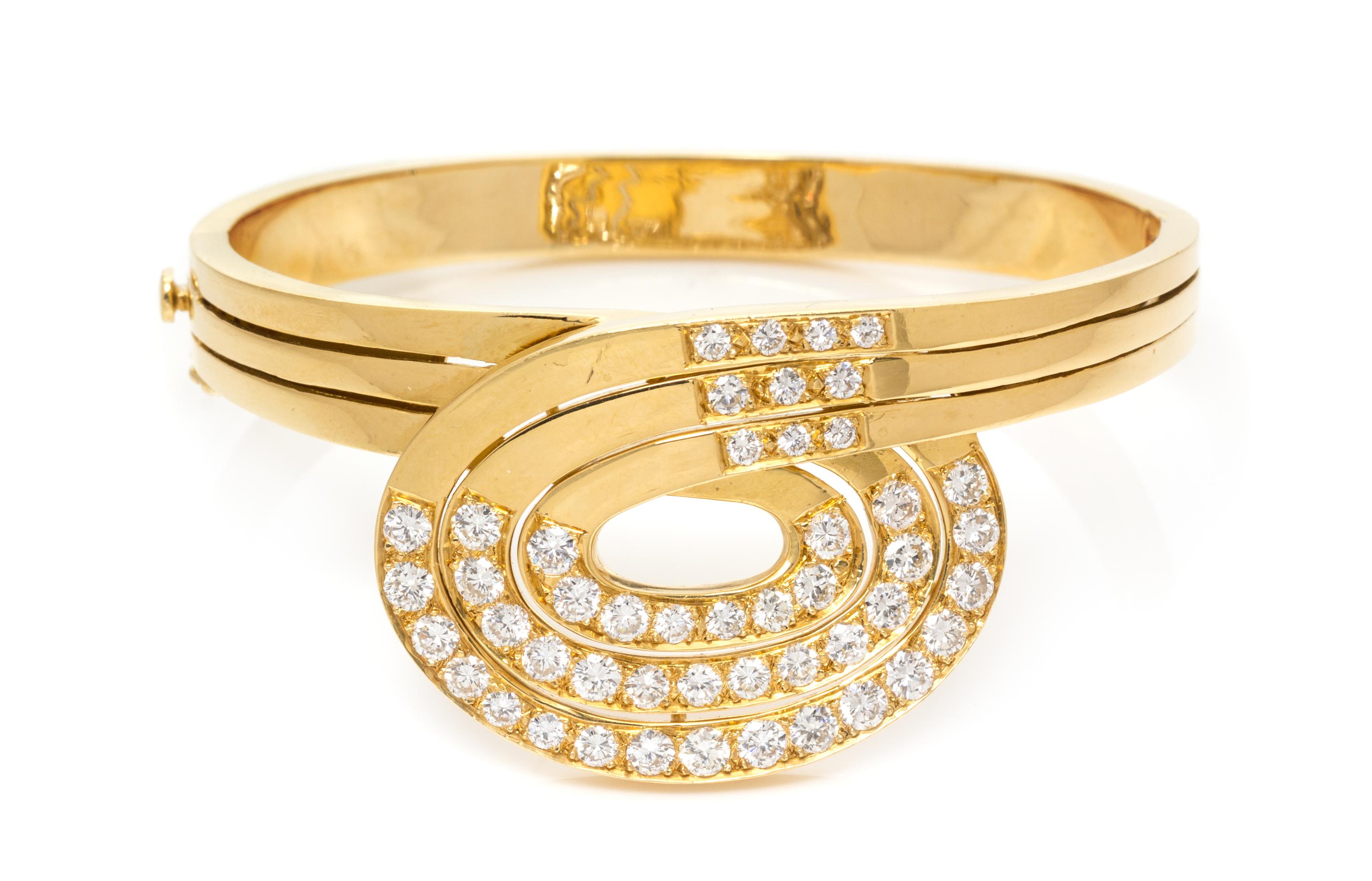 An 18 Karat Yellow Gold and Diamond Bangle Bracelet, 26.70 dwts.