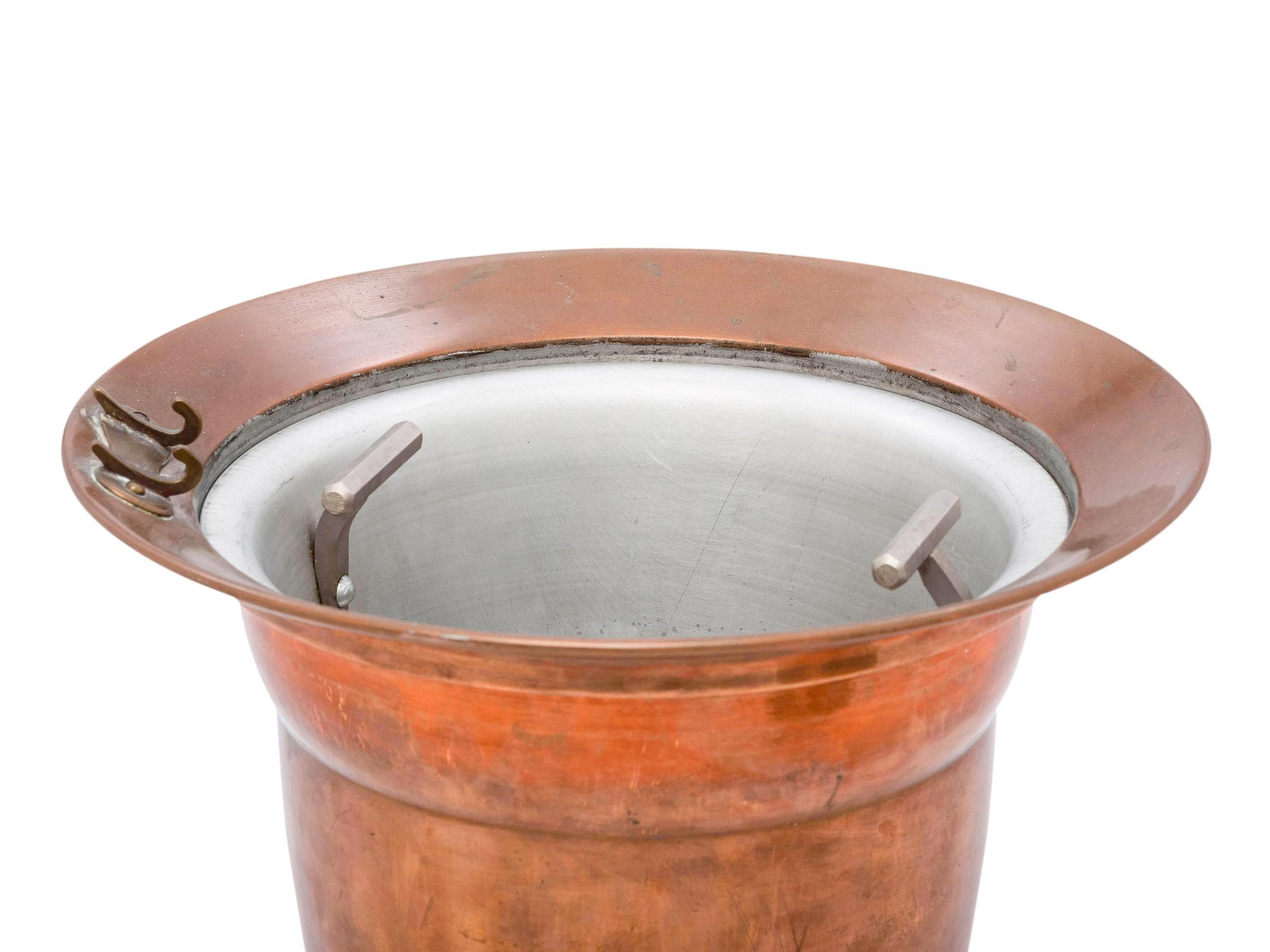 An American Brass, Copper and Aluminum Tureen with Lid and Stand