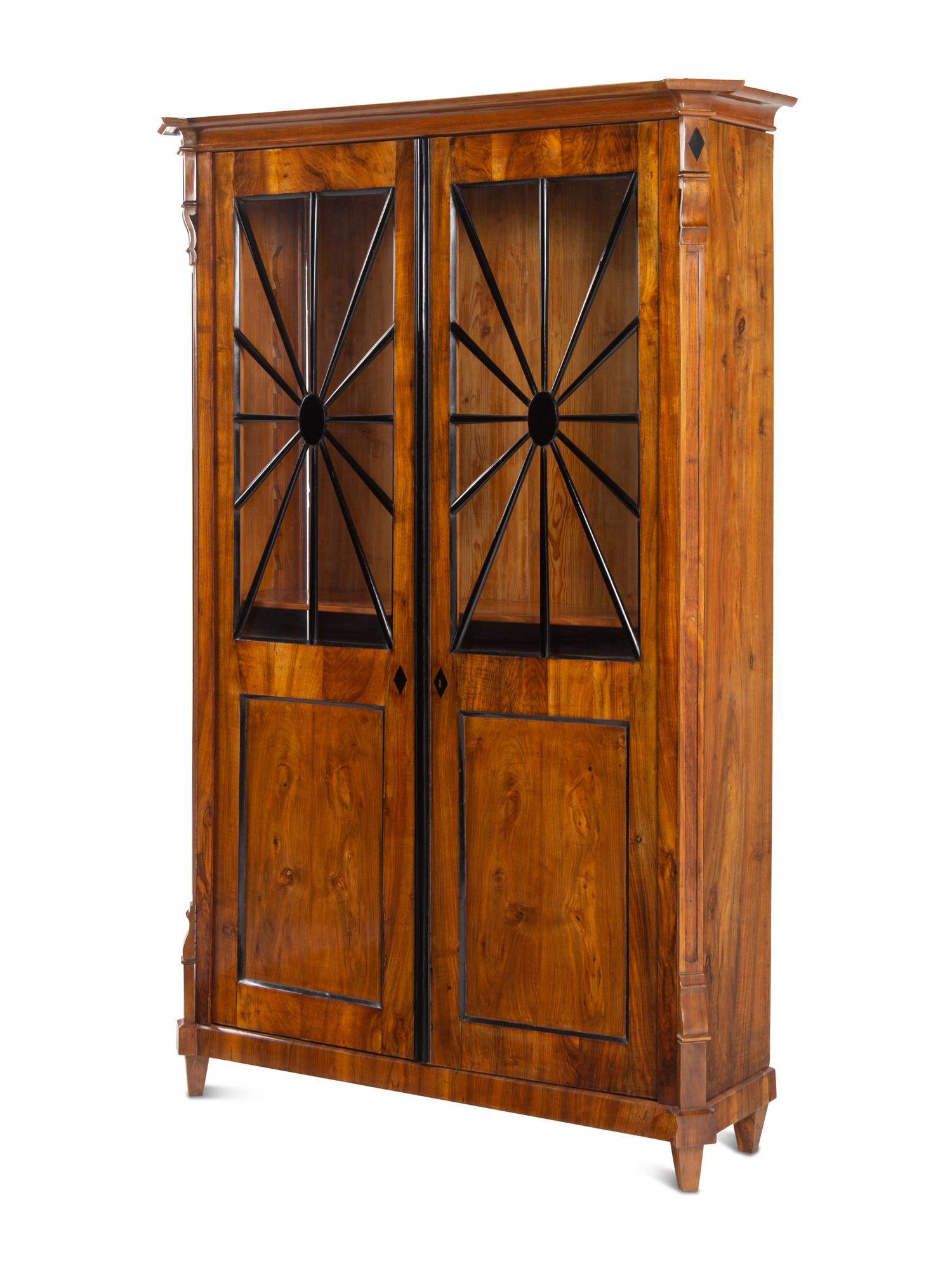 A Biedermeier Part-Ebonized Figured Walnut Bookcase