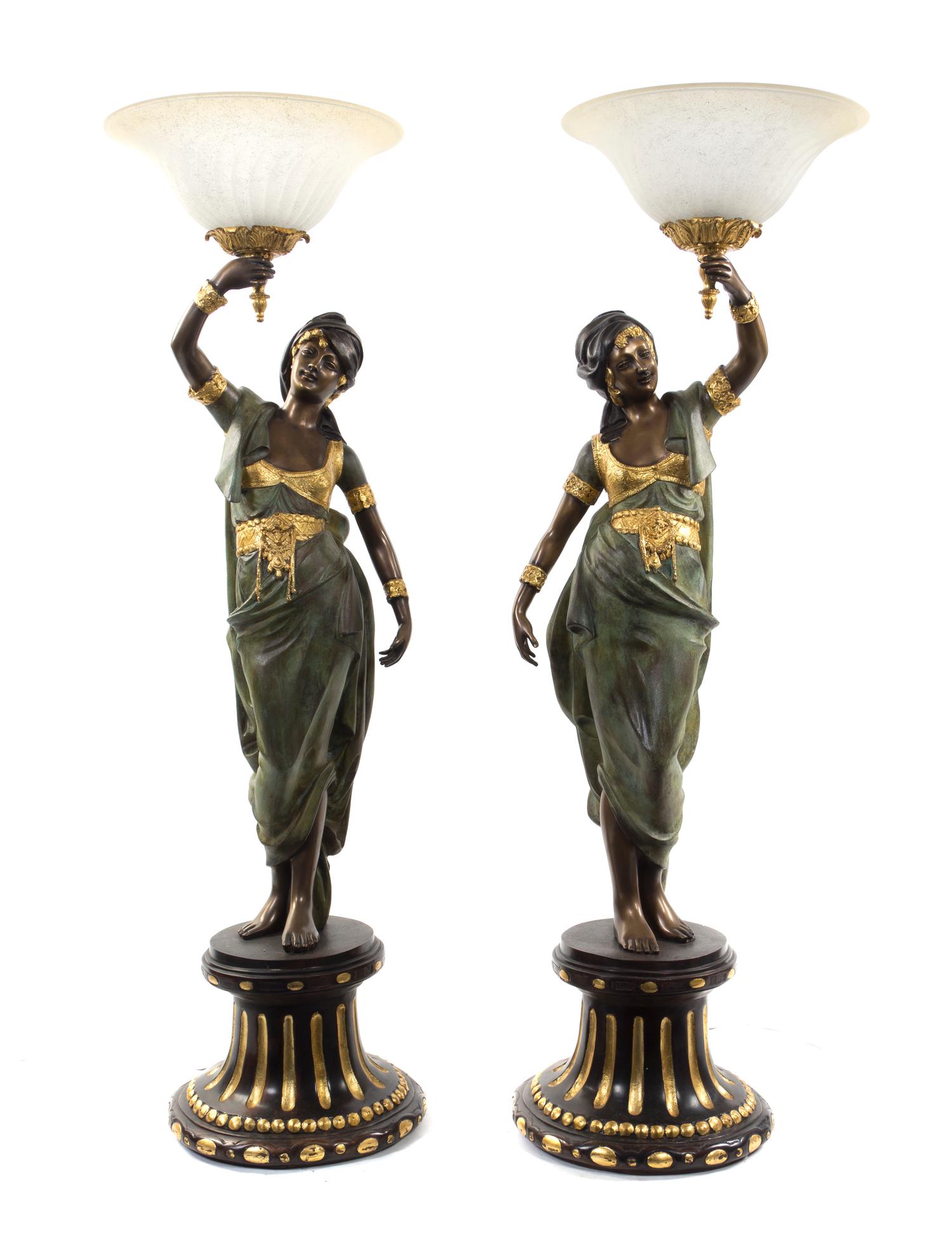 A Pair of Continental Cold Painted Metal Figural Torchieres, Height 52 1/2 inches.