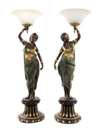 A Pair of Continental Cold Painted Metal Figural Torchieres, Height 52 1/2 inches.