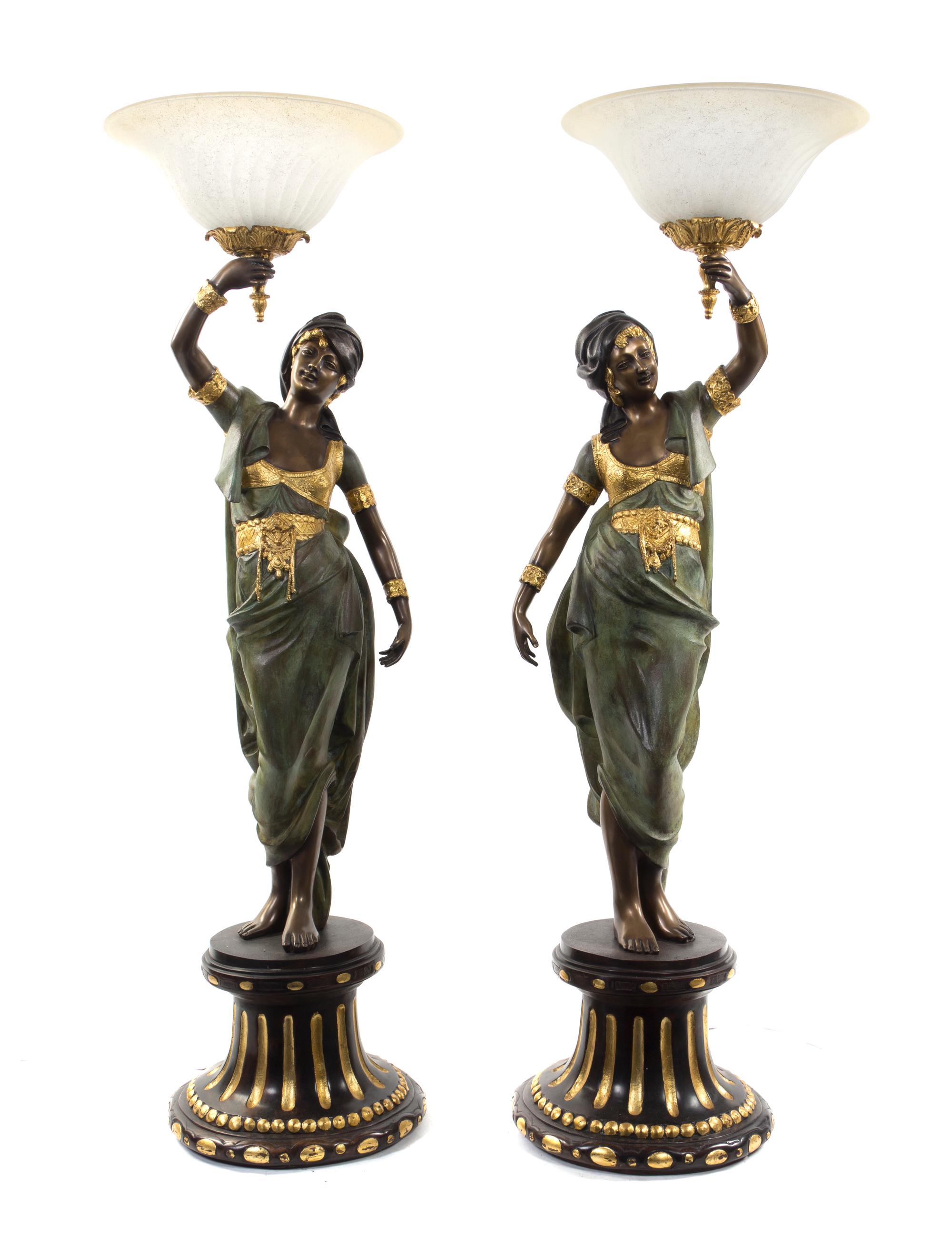 A Pair of Continental Cold Painted Metal Figural Torchieres, Height 52 1/2 inches.