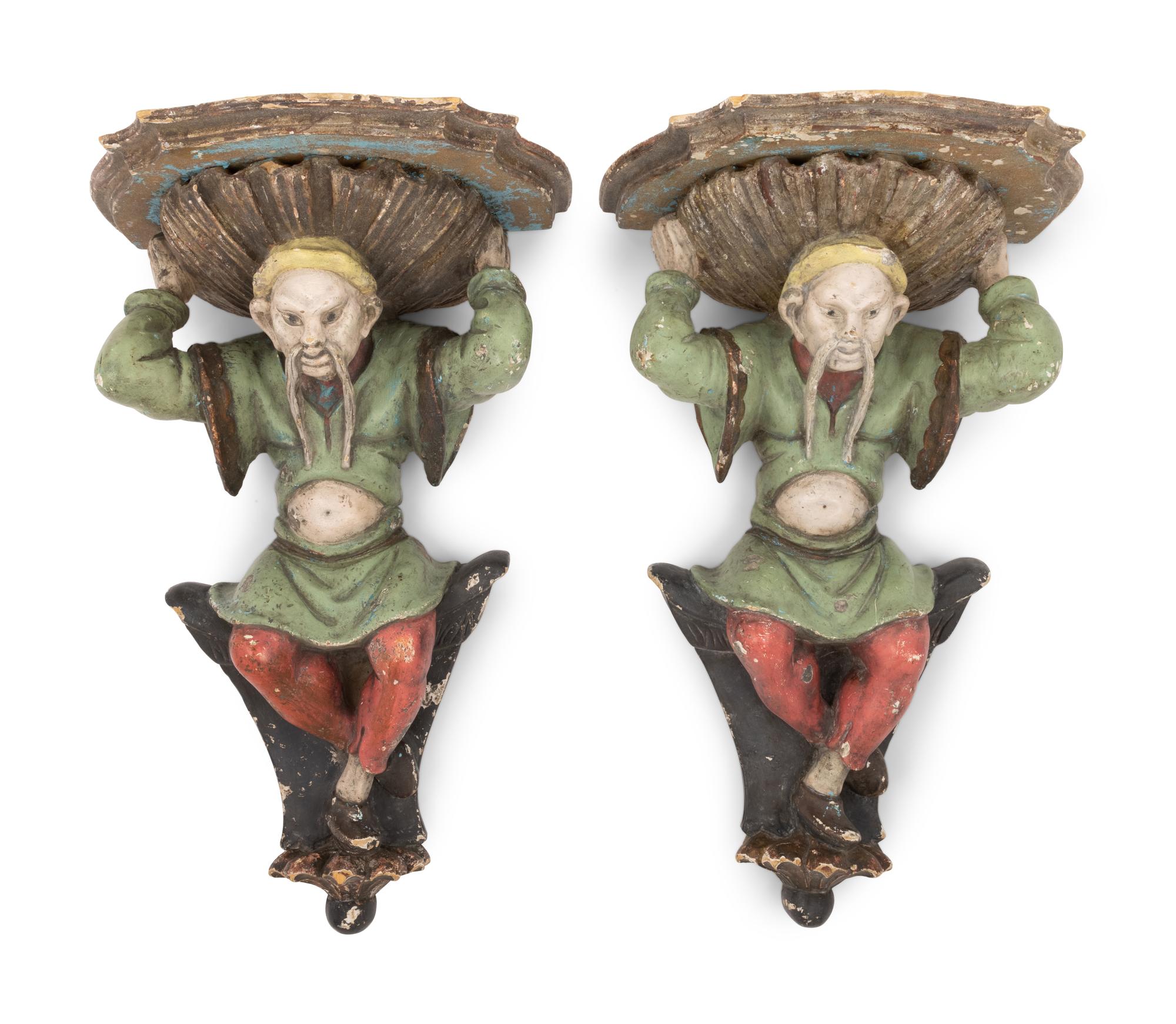 A Pair of Italian Carved and Polychrome Decorated Wood Figural Wall Brackets