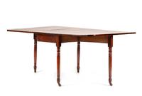 A George III Mahogany Drop-Leaf Dining Table Height 29 x length 66 (fully extended) x depth 42 inches. — EARLY 19TH CENTURY