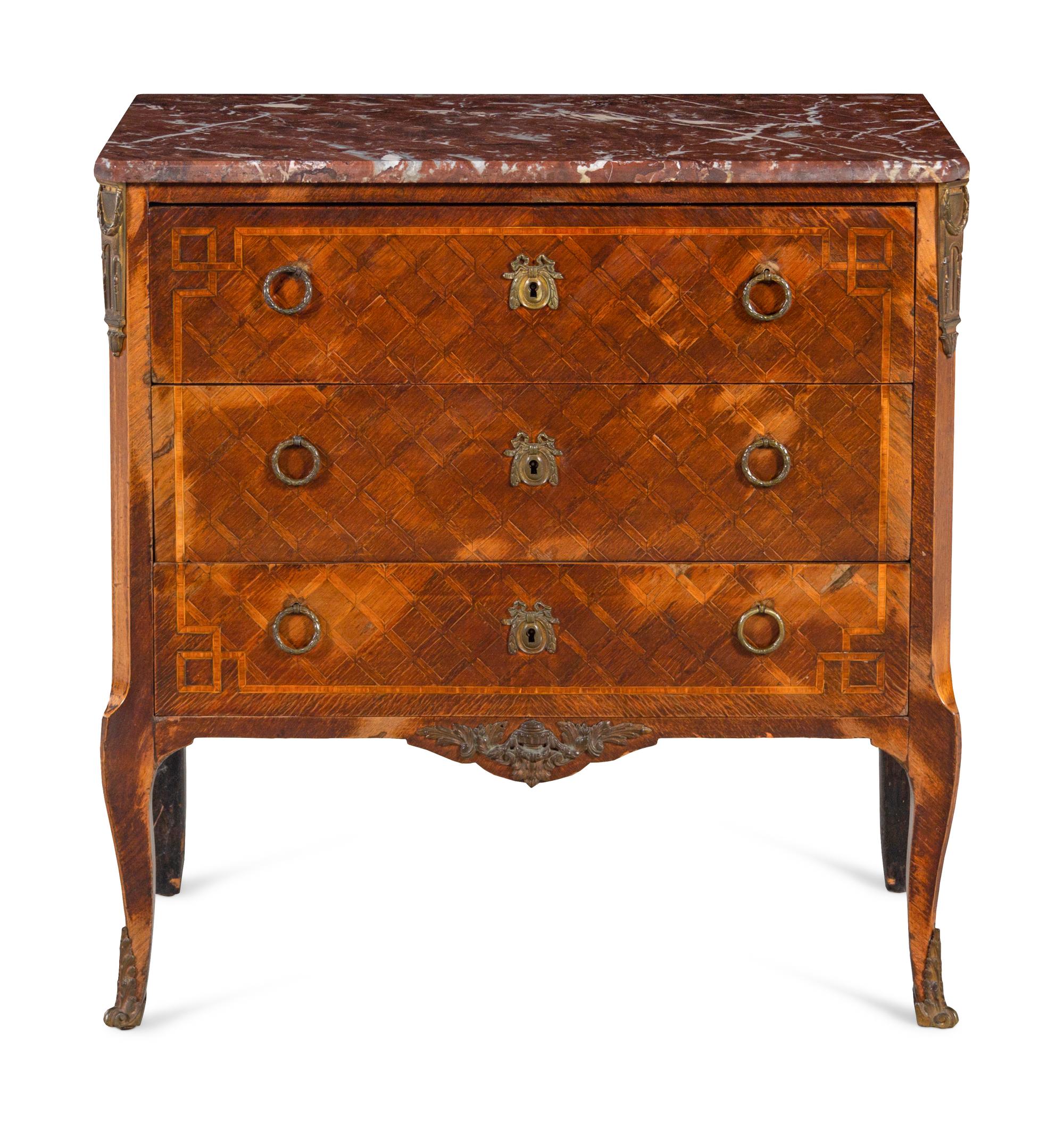 A Louis XV/XVI Transitional Style Gilt Metal Mounted Parquetry Marble Top Commode