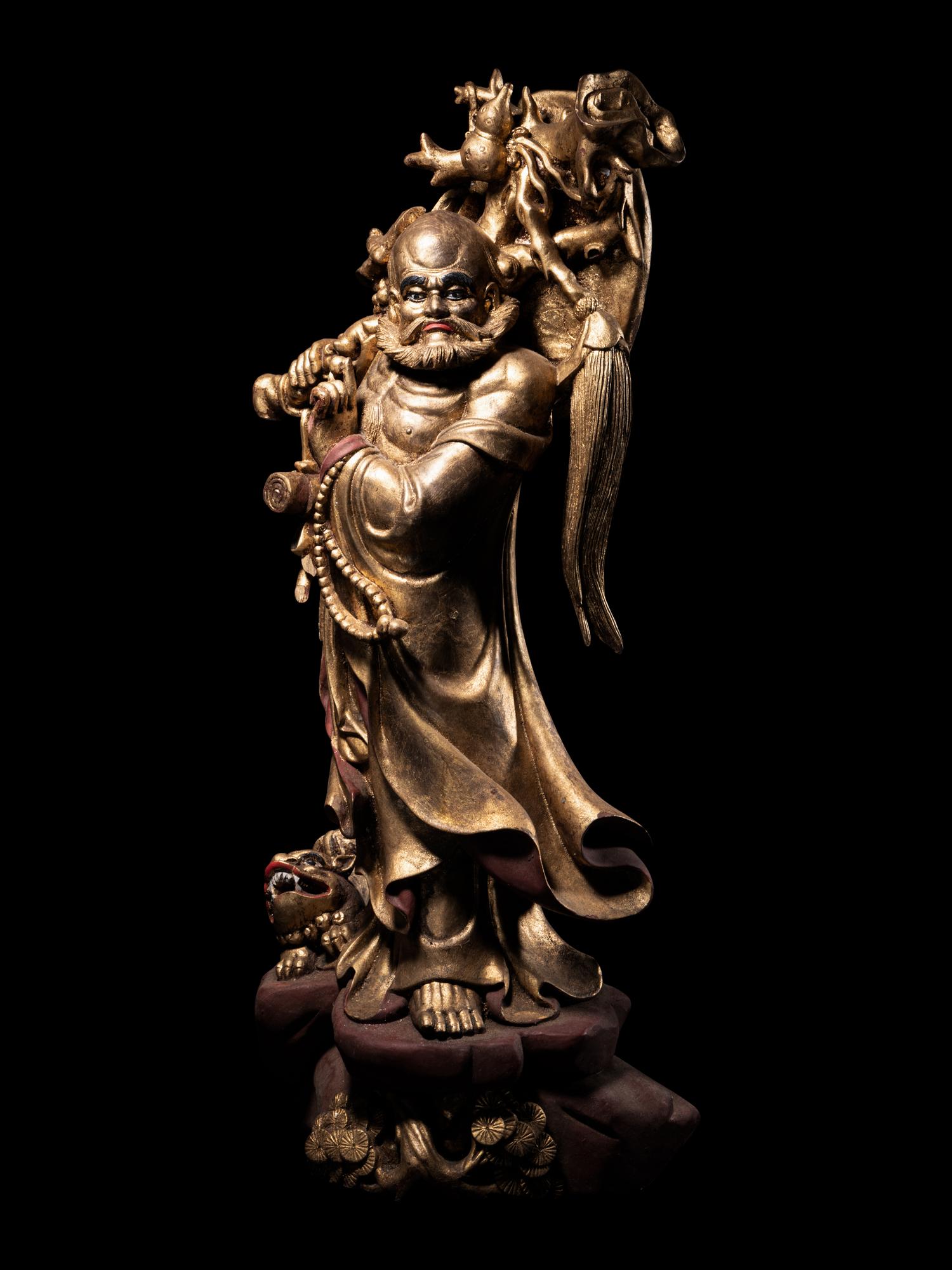 A Chinese Gilt Lacquered Wood Figure of Immortal