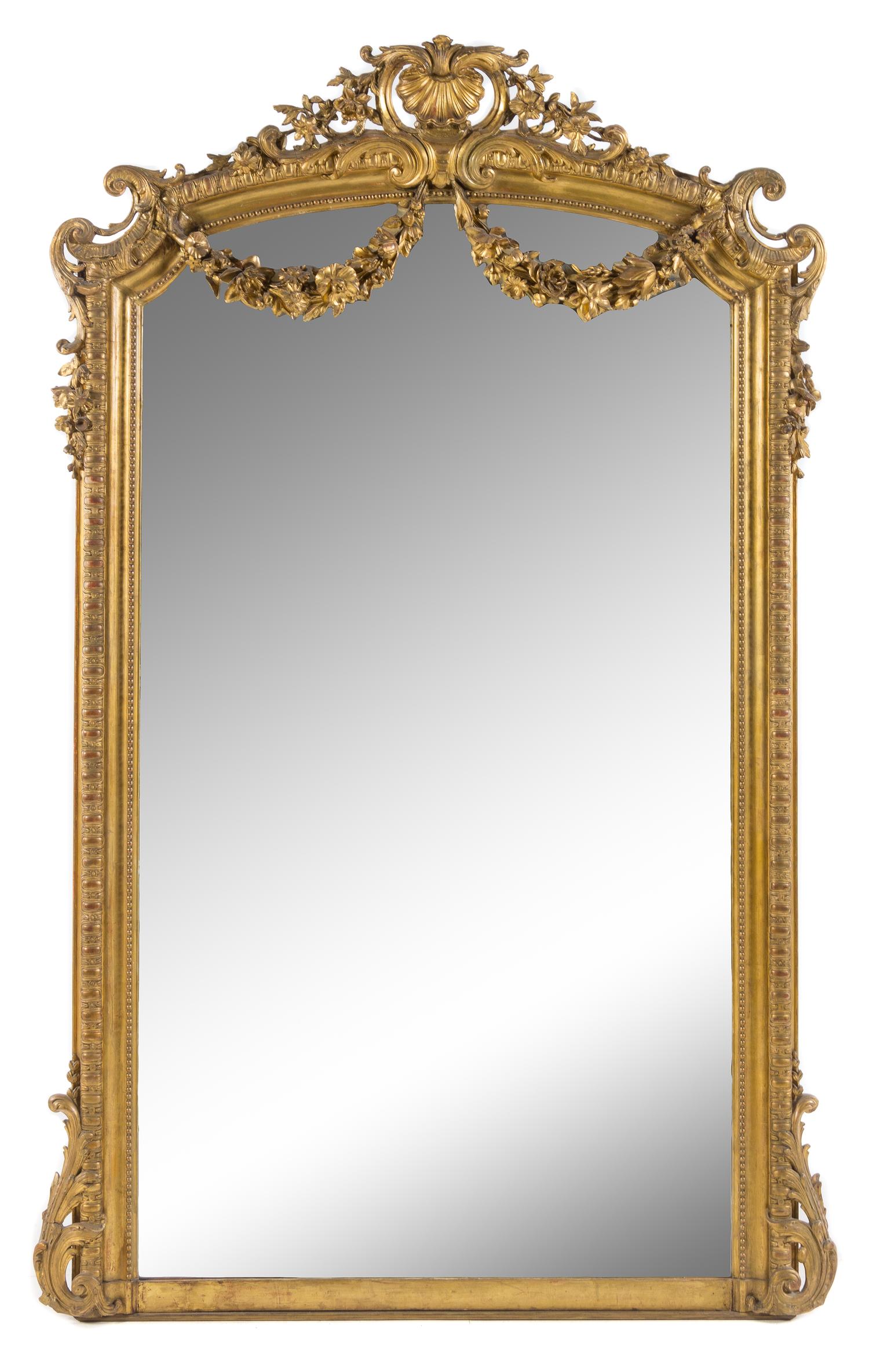 A Napoleon III Giltwood Overmantel Mirror Height 82 1/2 x width 51 inches. — 19TH CENTURY
