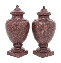 A Pair of Neoclassical Style Carved Porphyry Covered Urns