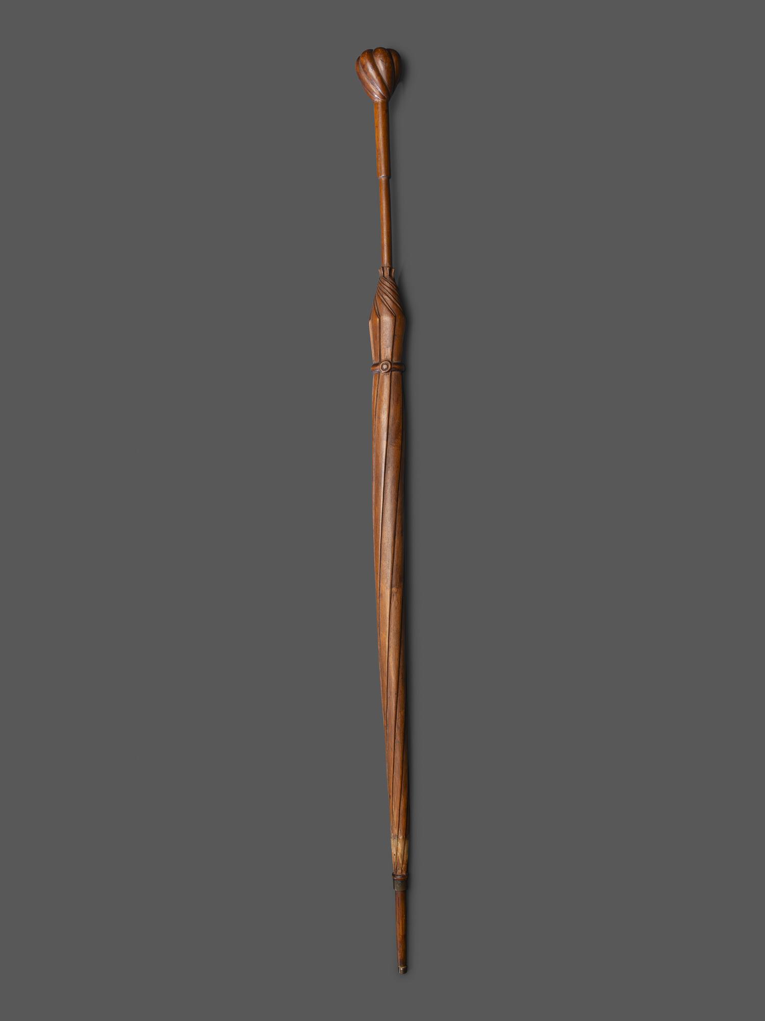 A Folk Art Carved Wood Umbrella Form Cane
