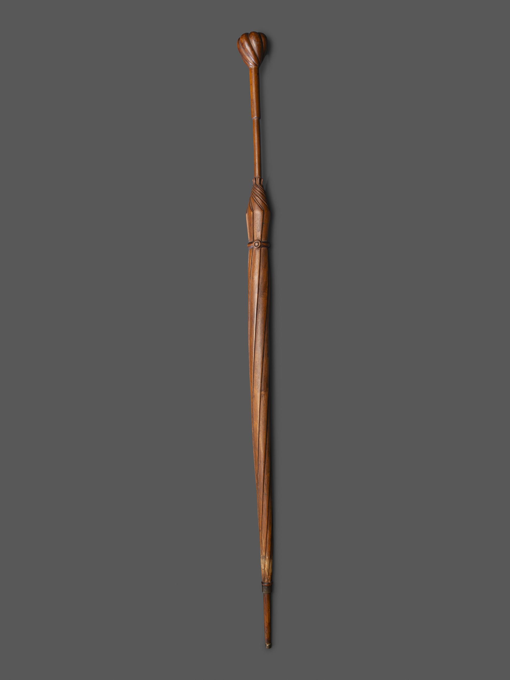 A Folk Art Carved Wood Umbrella Form Cane