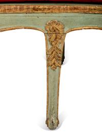 A Pair of Louis XV Green-Painted and Parcel-Gilt Cane Seat Window Benches