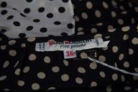 An Yves Saint Laurent Black and Ivory Silk Polka Dot Blouse, Size 36.