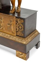 A Louis Philippe Gilt and Patinated Bronze Figural Mantel Clock