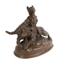A French Patinated Bronze Group of Dogs — CAST AFTER A MODEL BY THOMAS FRANCOIS CARTIER (FRENCH, 1879-1943)