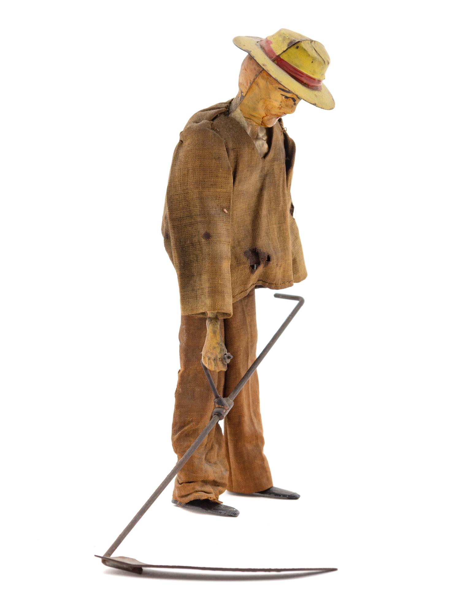 A Fernand Martin Tin Wind-Up "Wheat Farmer" Toy