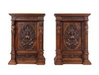 A Pair of Renaissance Revival Carved Walnut Marble-Top Cabinets
