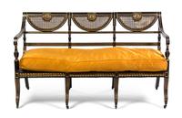 A Regency Ebonized and Parcel Gilt Triple-Back Settee, Width 61 1/4 inches.