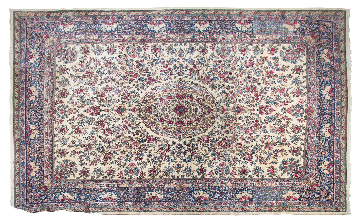 A Kirman Wool Rug 13 feet 10 inches x 10 feet 5 inches.