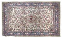 A Kirman Wool Rug 13 feet 10 inches x 10 feet 5 inches.