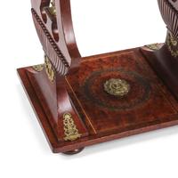 An Empire Style Mahogany and Gilt Bronze Mounted Table