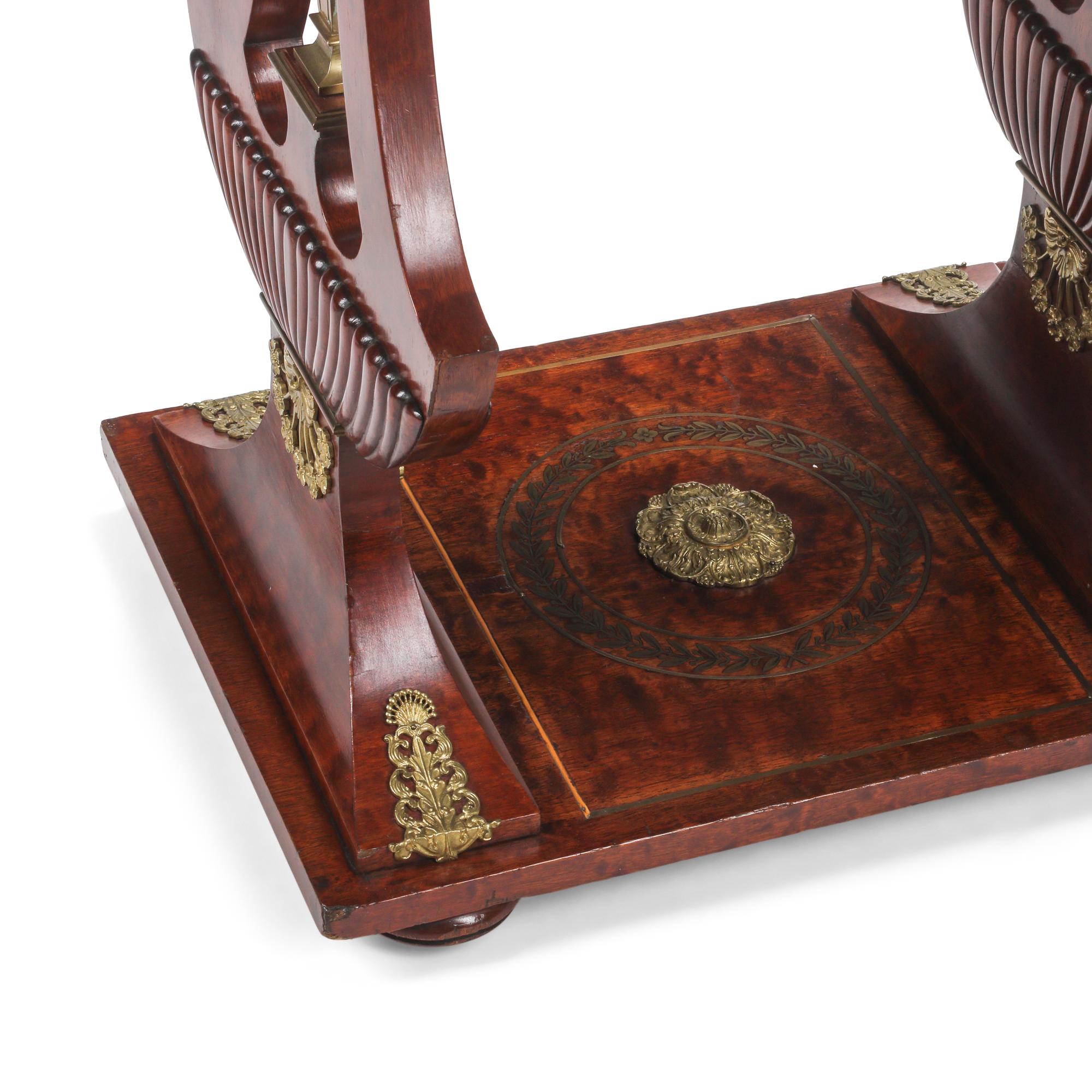 An Empire Style Mahogany and Gilt Bronze Mounted Table