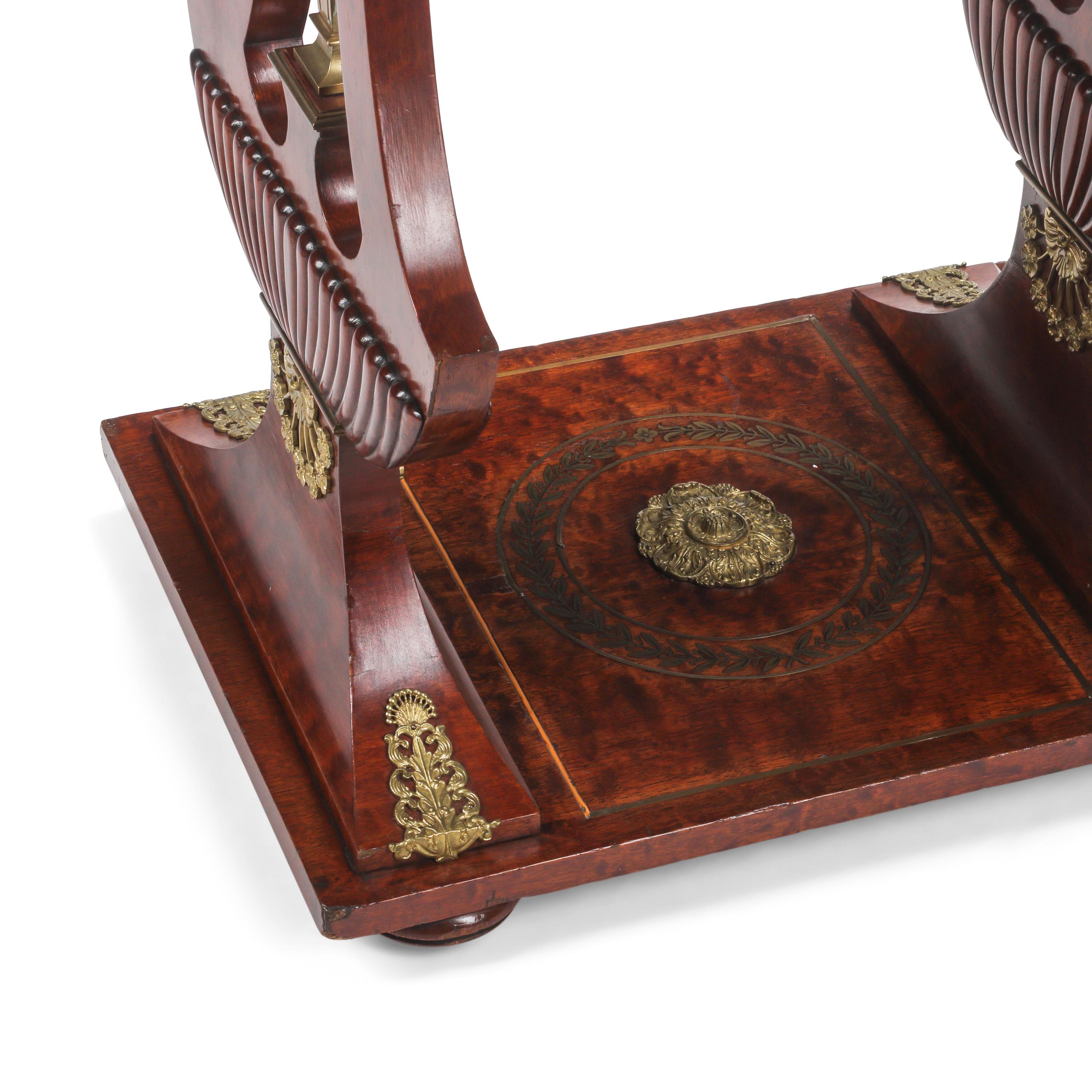 An Empire Style Mahogany and Gilt Bronze Mounted Table