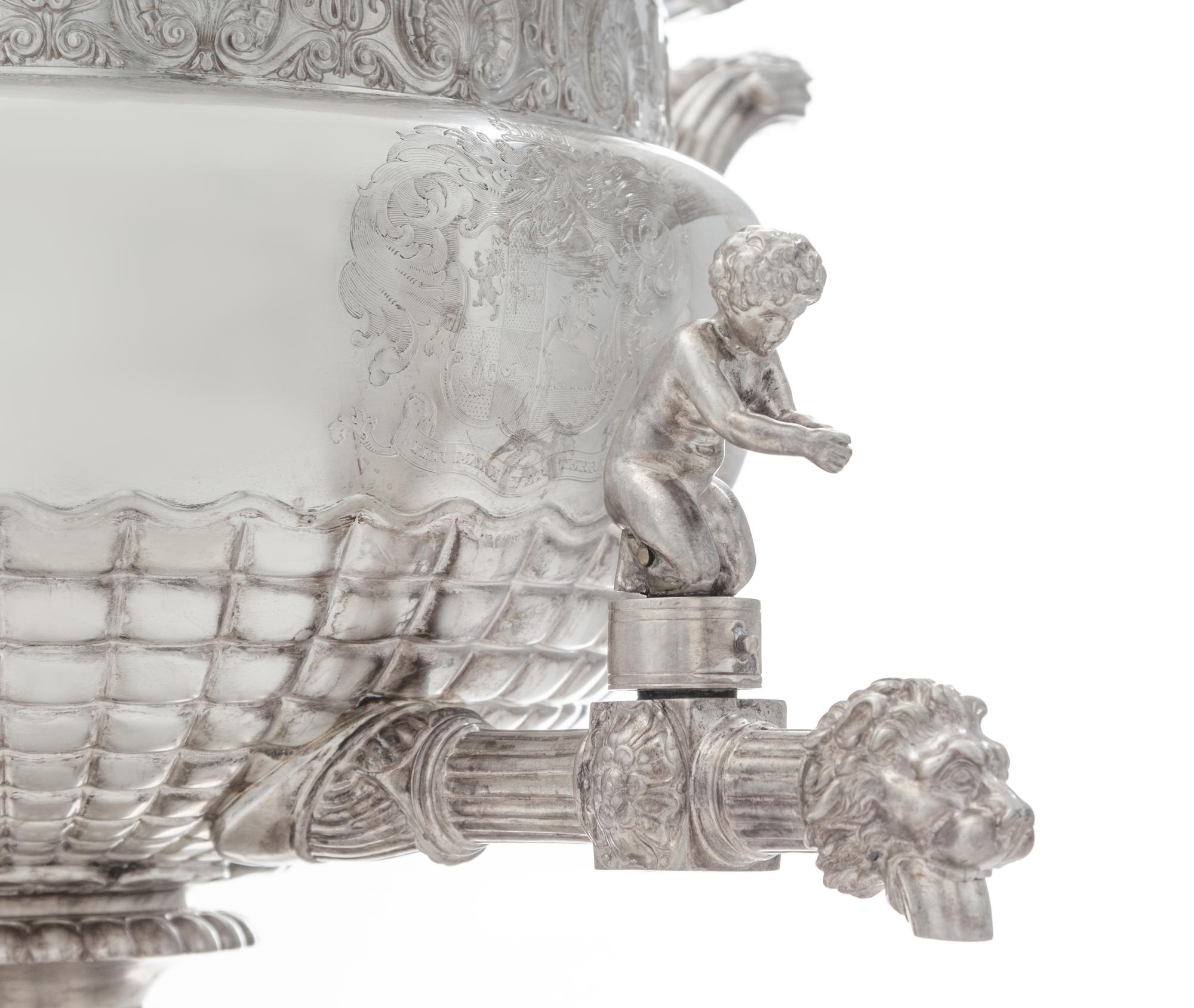 A George III Silver Tea Urn, Paul Storr, London, 1813, the domed lid with a blossom finial, the body with a gadroon and rocaille rim ab