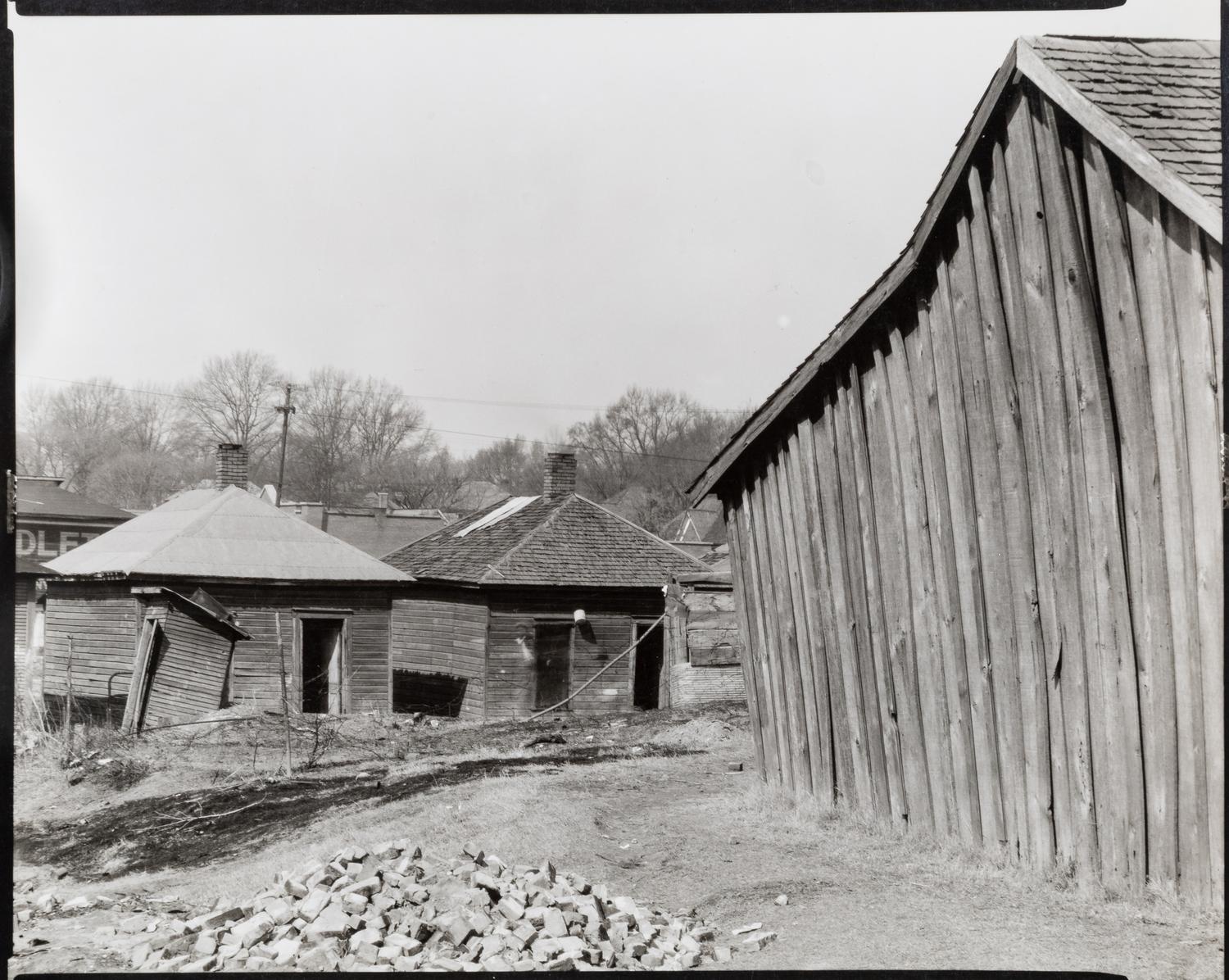 Walker Evans (1903-1975) Scott's Rim Mining Camp, near Morgantown, West Virginia; Untitled (Miners' huts;) and Company Houses for Miners, Masontown, Near Preston County, West Virginia, 1935
