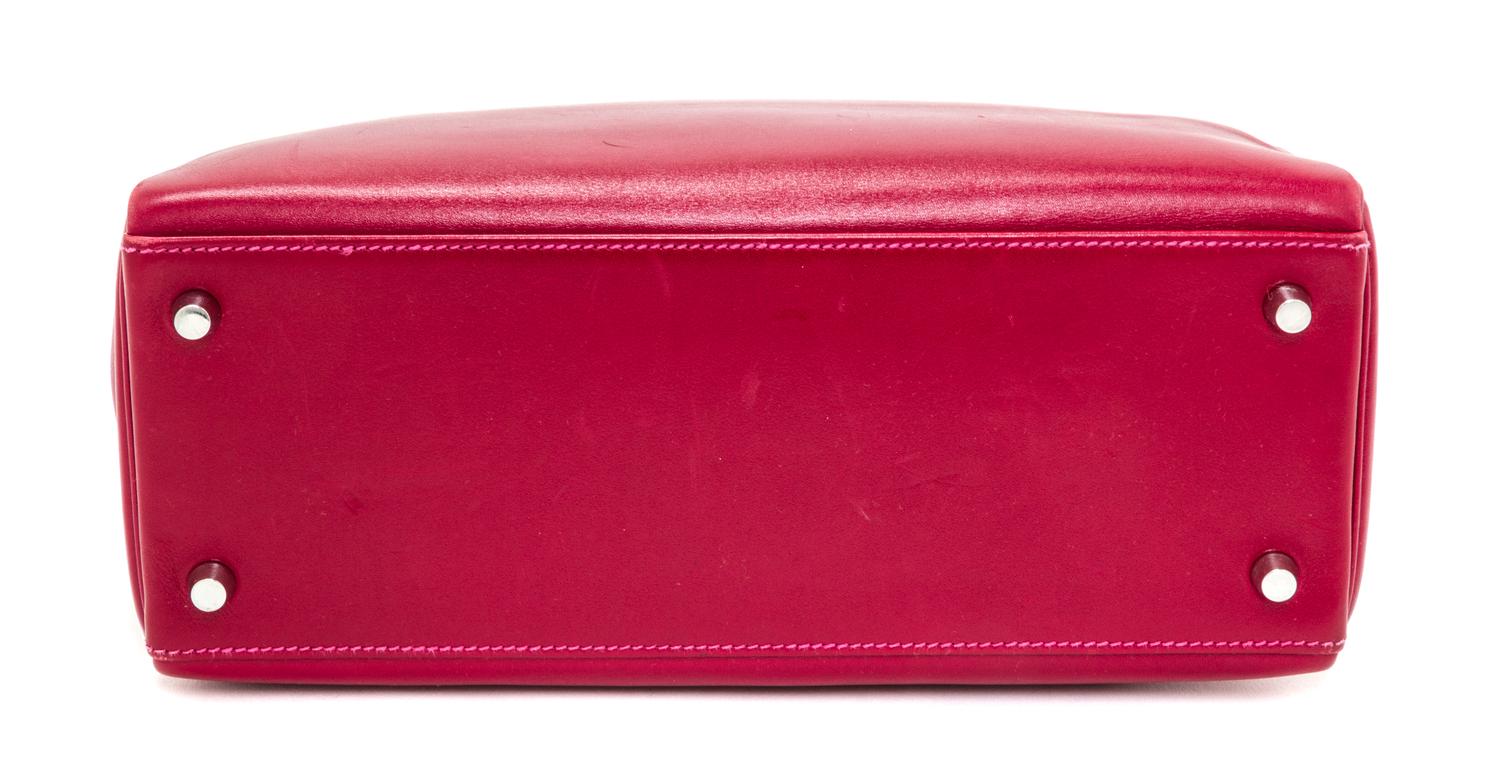 An Hermes Rubis and Rose Tyrien Candy Tadelakt and Chevre Retorne 28cm Kelly Handbag, 11" x 8.5" x 4".