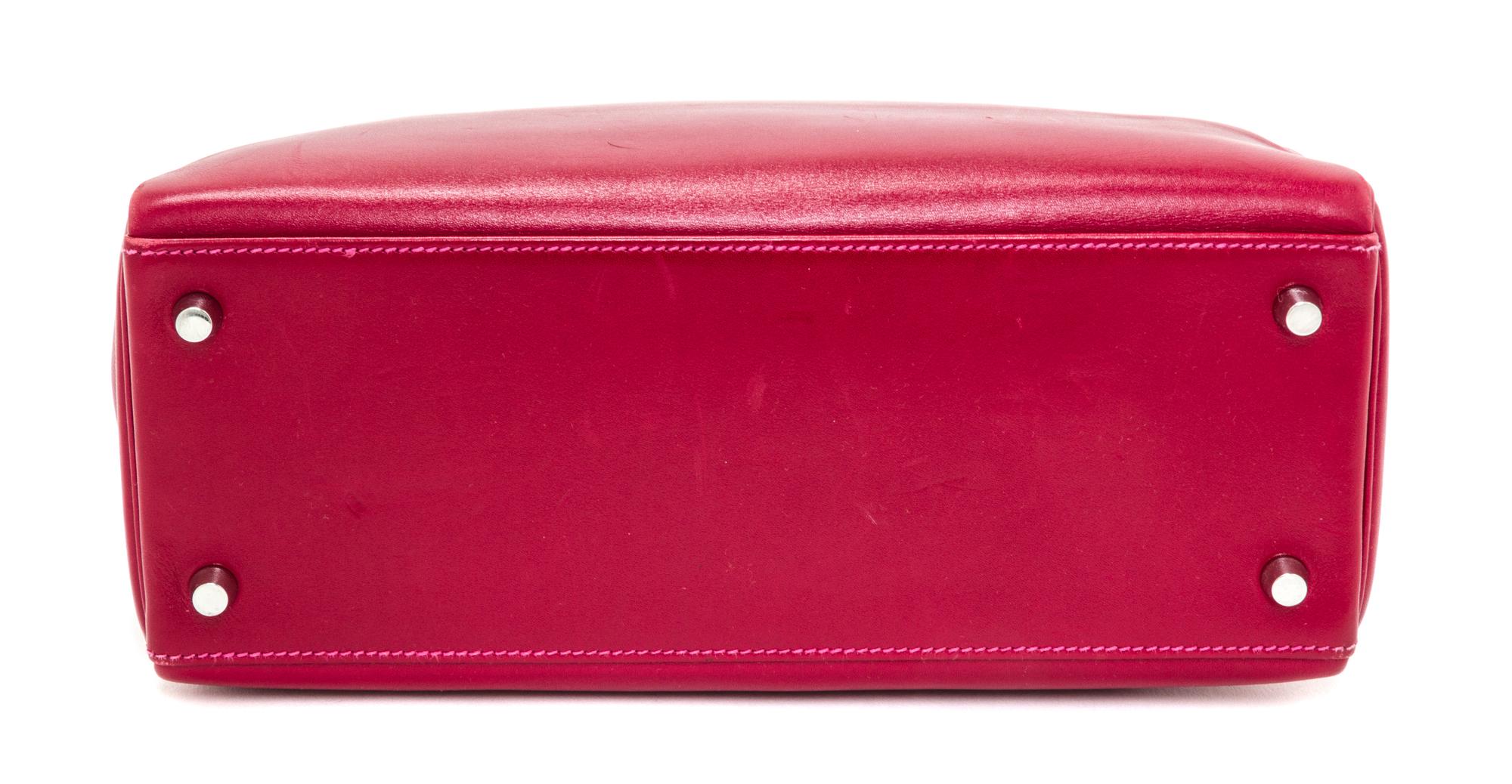 An Hermes Rubis and Rose Tyrien Candy Tadelakt and Chevre Retorne 28cm Kelly Handbag, 11" x 8.5" x 4".