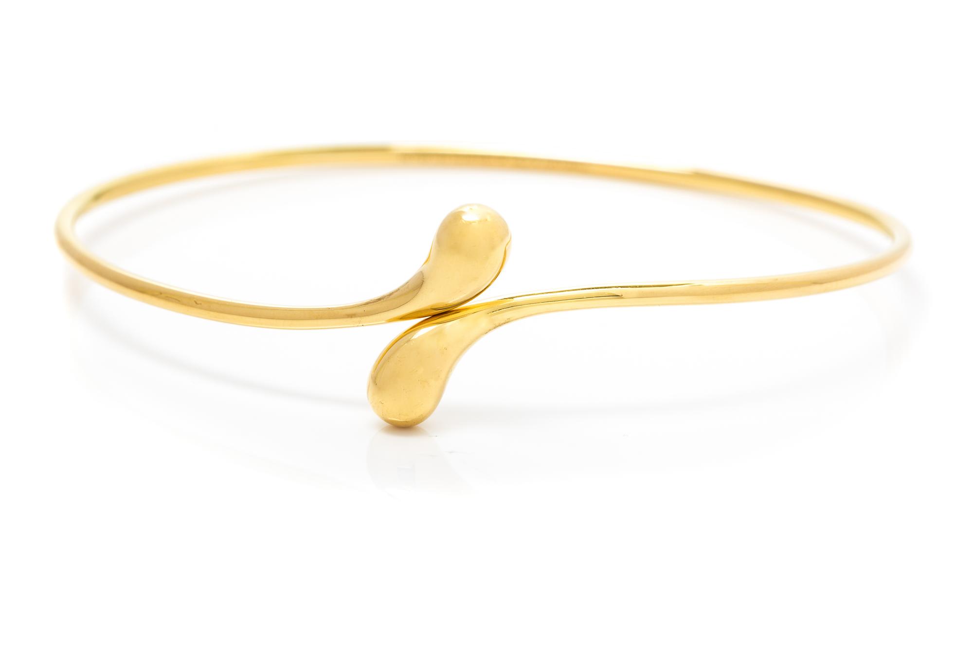 An 18 Karat Yellow Gold "Elongated Teardrop" Bangle Bracelet, Elsa Peretti for Tiffany & Co., 9.10 dwts.