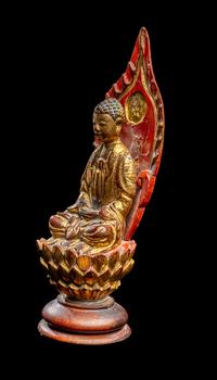 A Gilt and Red Lacquered Wood Figure of Buddha