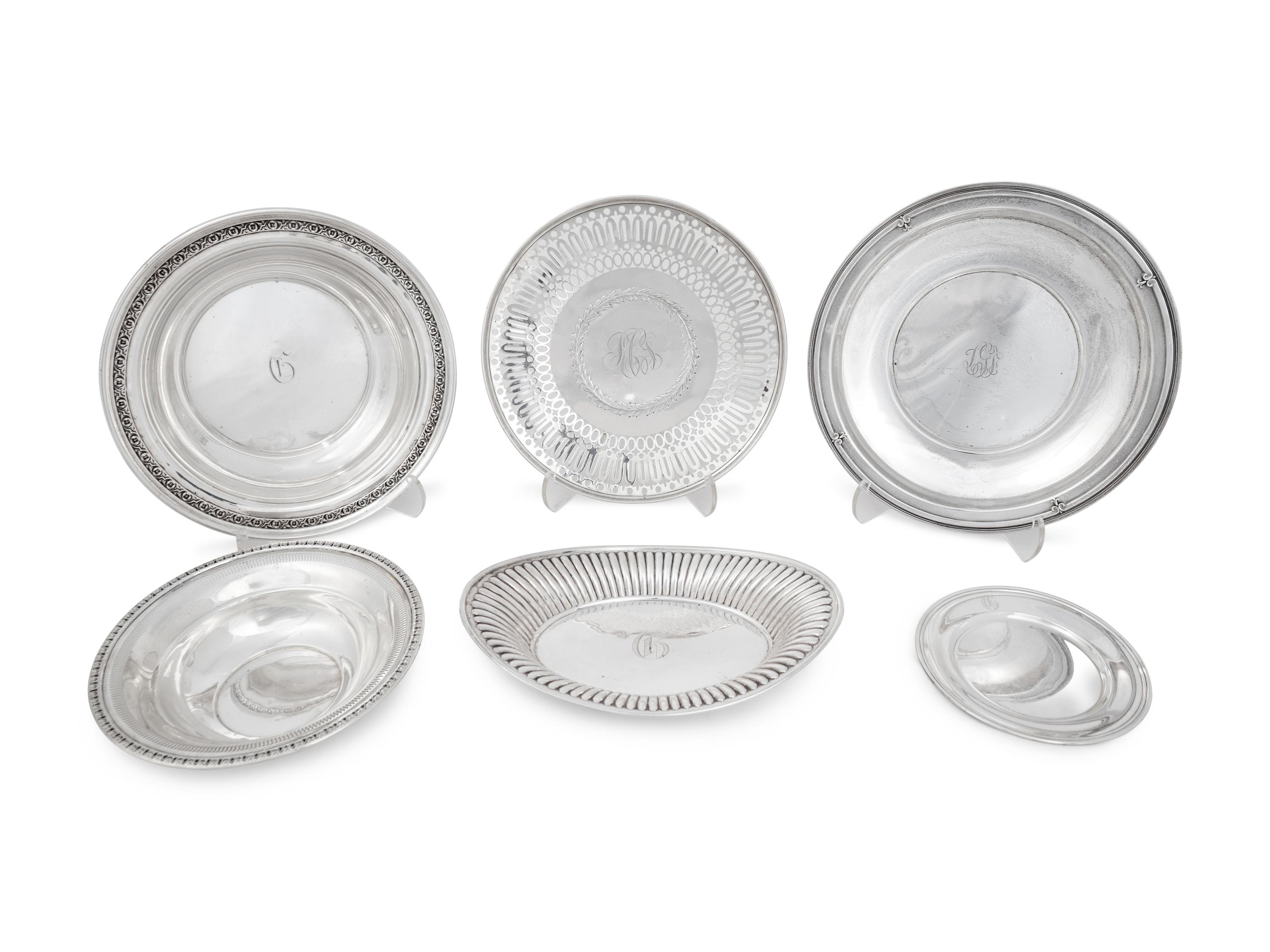 Thirteen Silver Plates and Platters