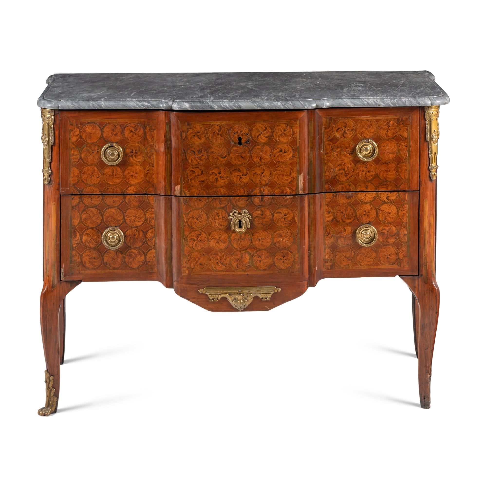 A Louis XV/XVI Transitional Gilt Bronze Mounted Marquetry Tulipwood and Amaranth Commode
