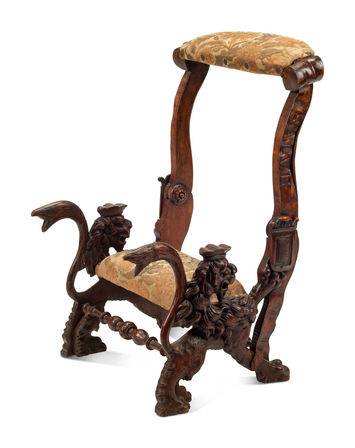 An Italian Carved Walnut Low Armchair