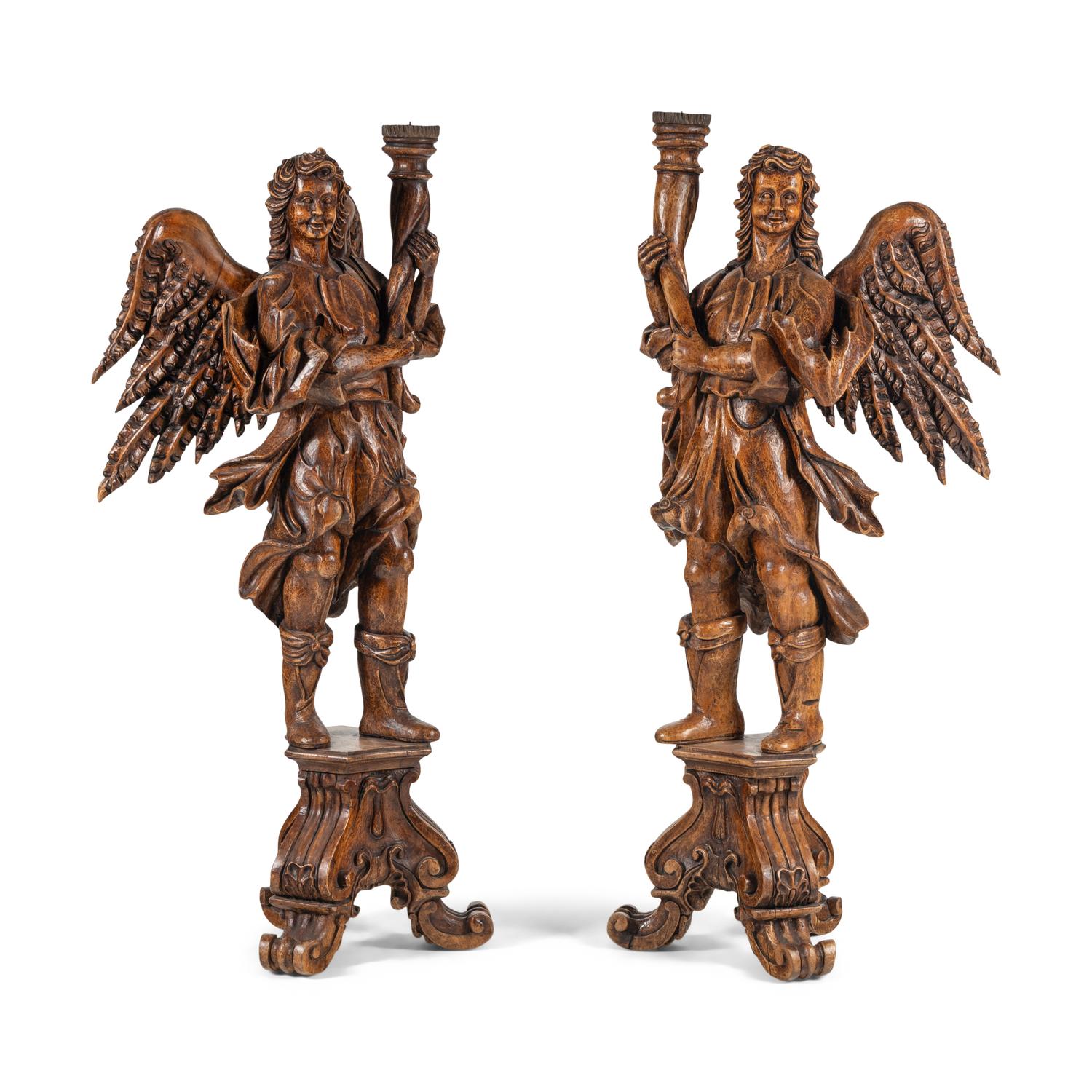 A Pair of Monumental Carved Walnut Figural Torchères