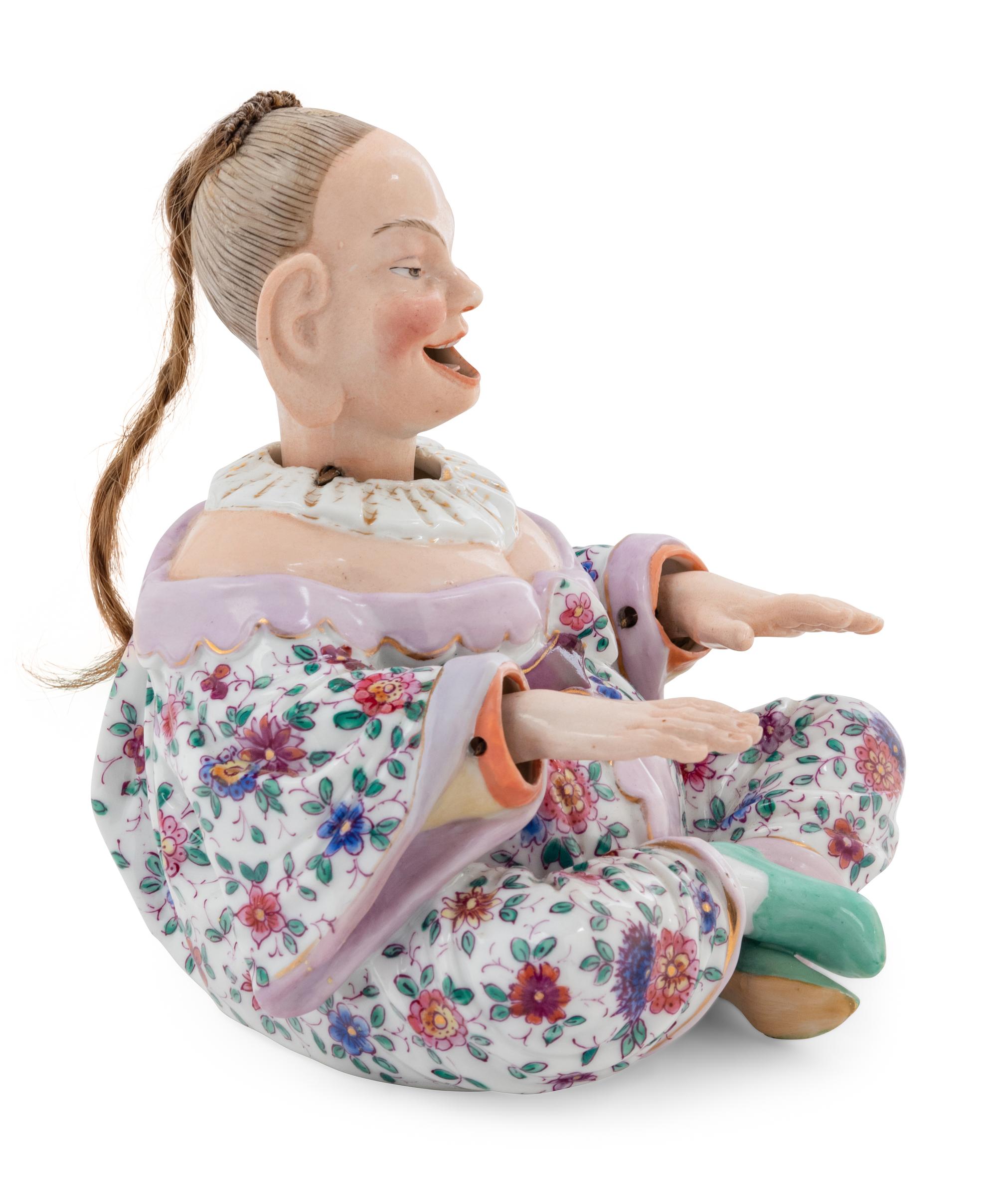 A German Porcelain "Nodder" Figure
