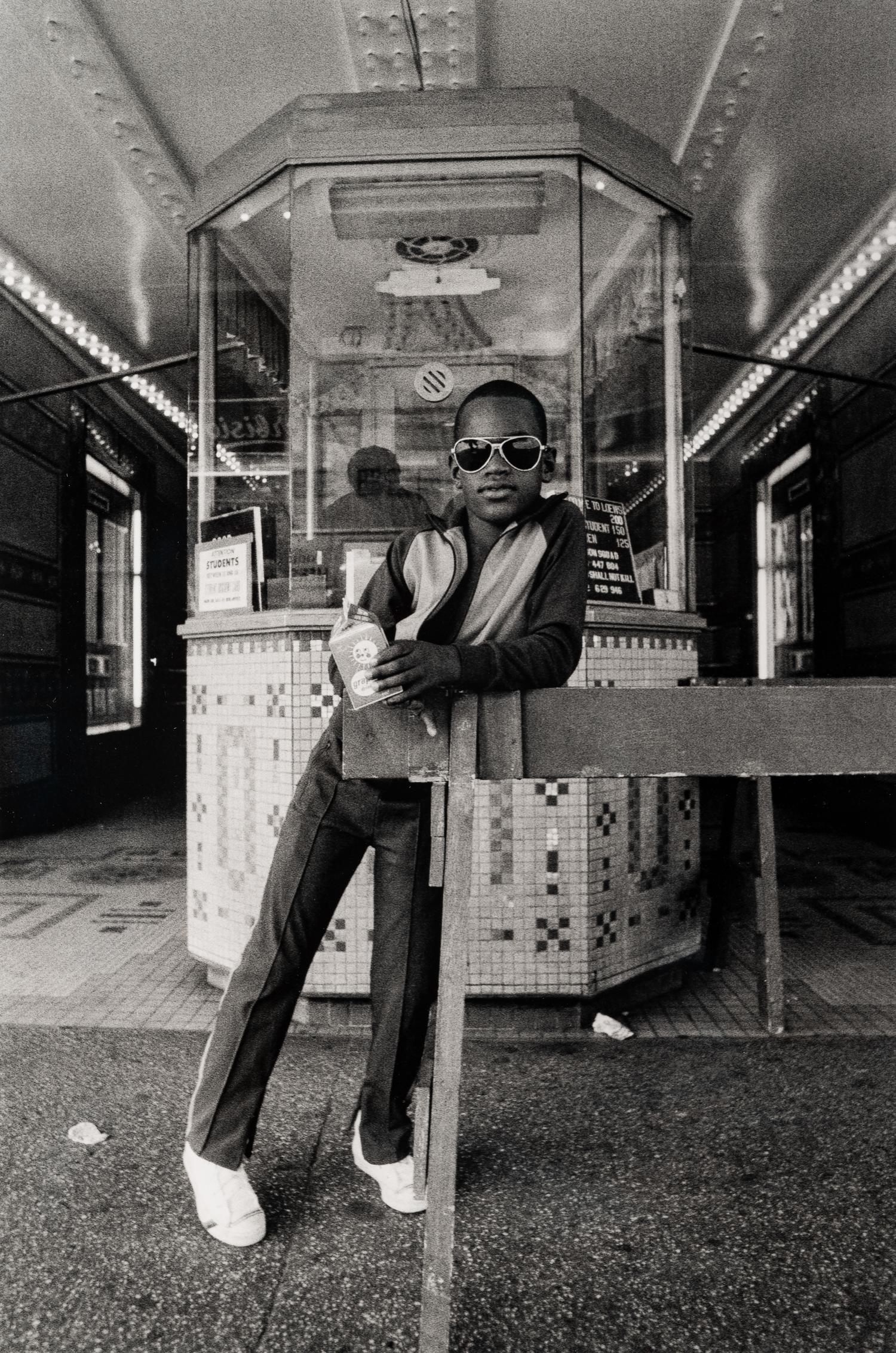 A Boy in Front of the Lowe's 125th Street Movie Theatre, 1976 (printed 2012)