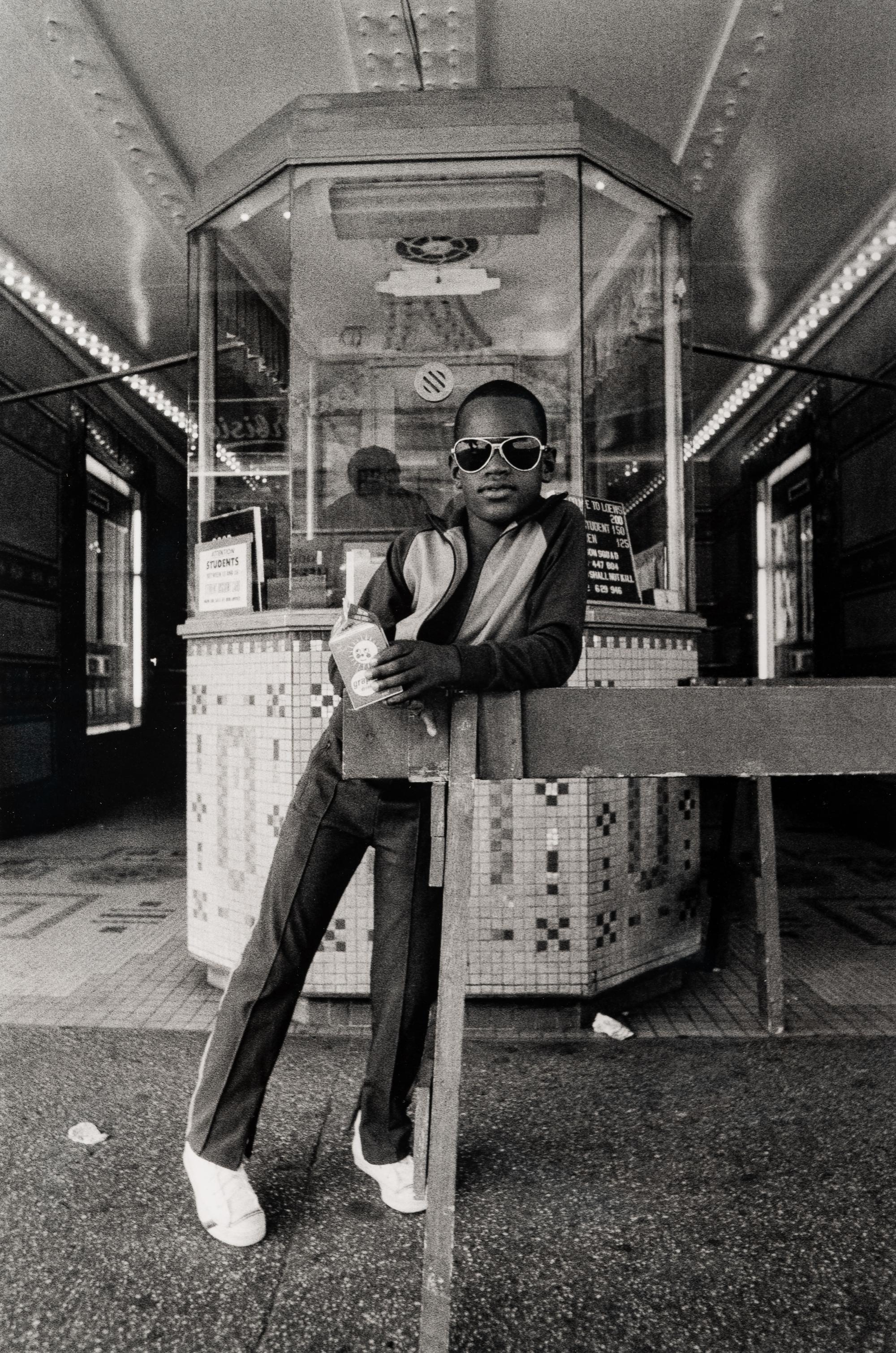 A Boy in Front of the Lowe's 125th Street Movie Theatre, 1976 (printed 2012)