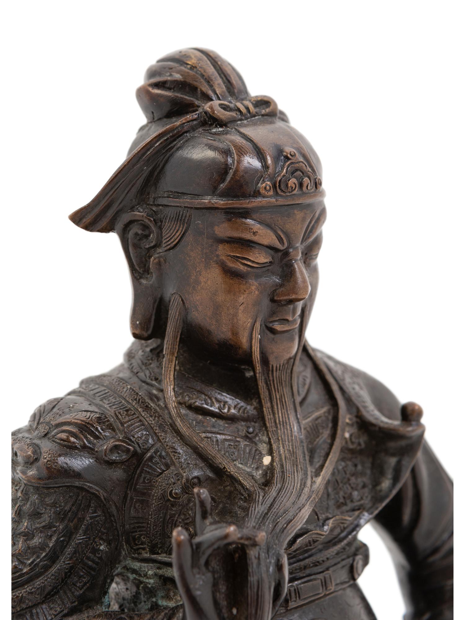 A Chinese Bronze Figure of a Seated Guardian, Guangong