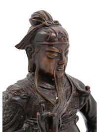 A Chinese Bronze Figure of a Seated Guardian, Guangong