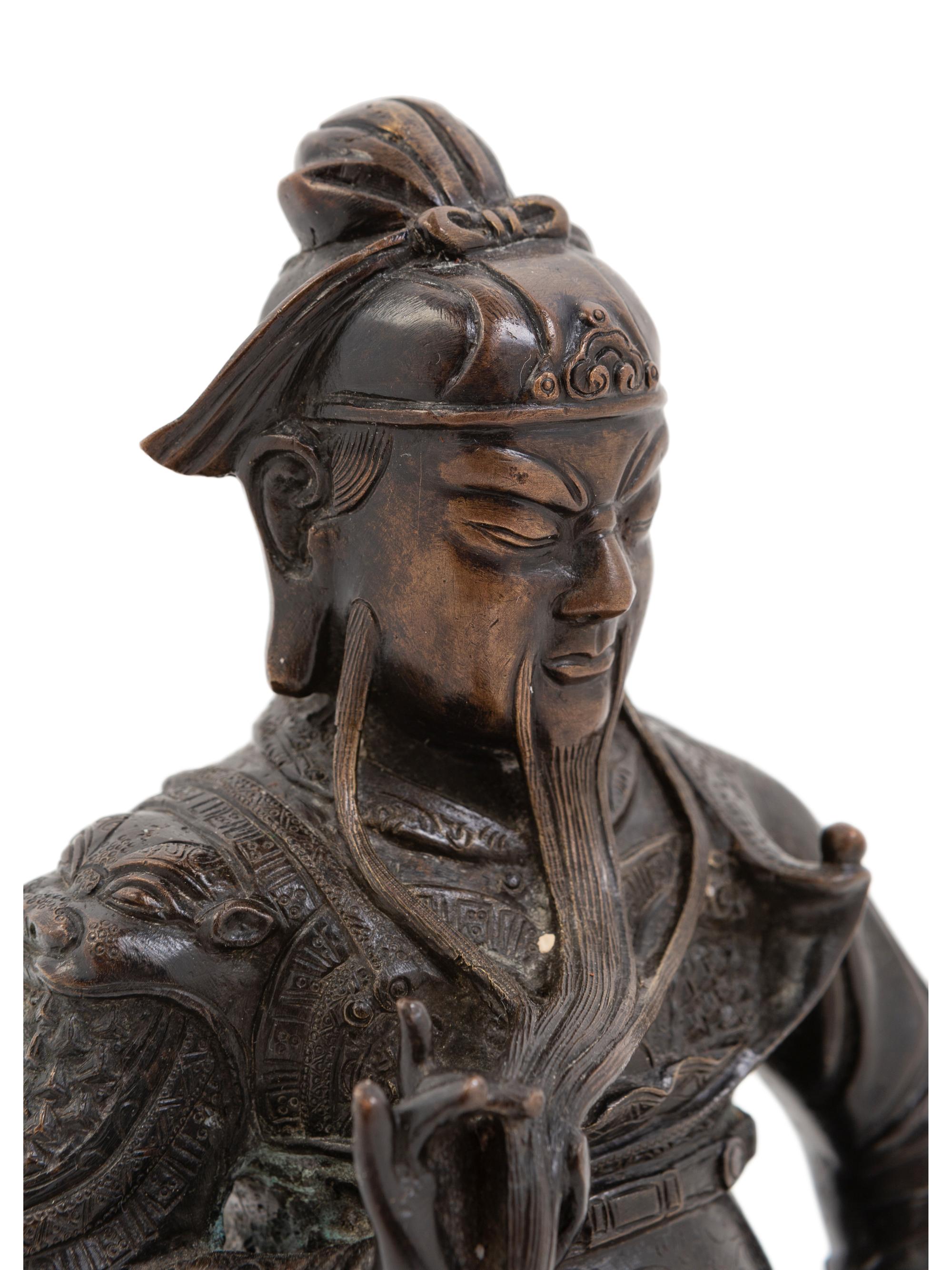 A Chinese Bronze Figure of a Seated Guardian, Guangong