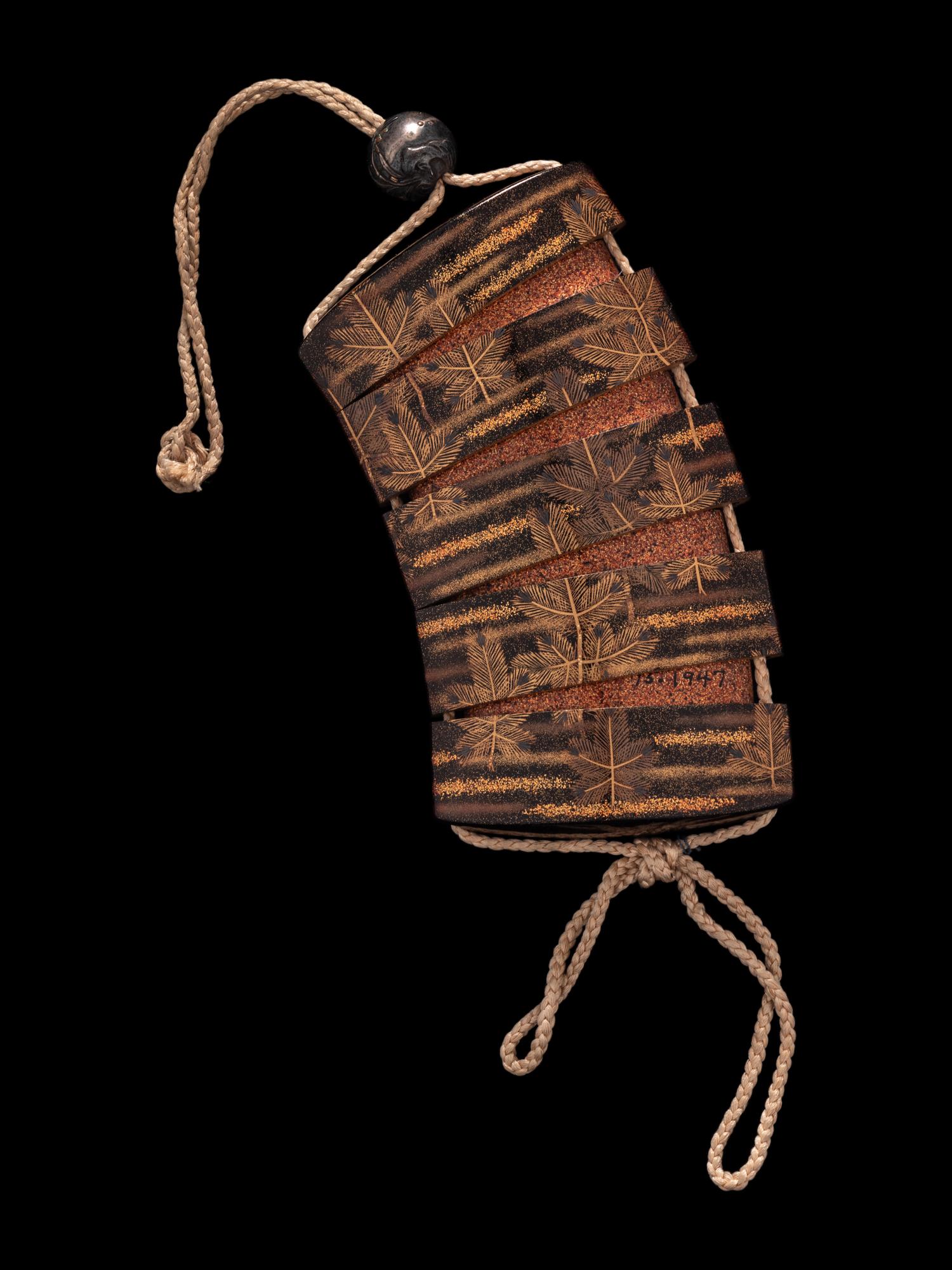 A Japanese Gold and Black Four-Case Inro