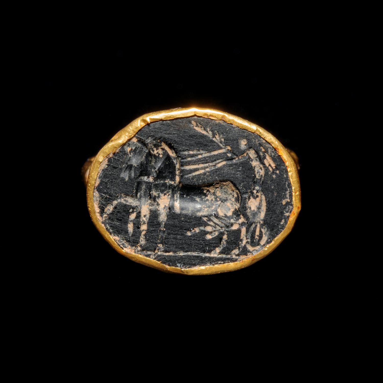 A Roman Gold Finger Ring with an Intaglio of Nike Riding a Chariot