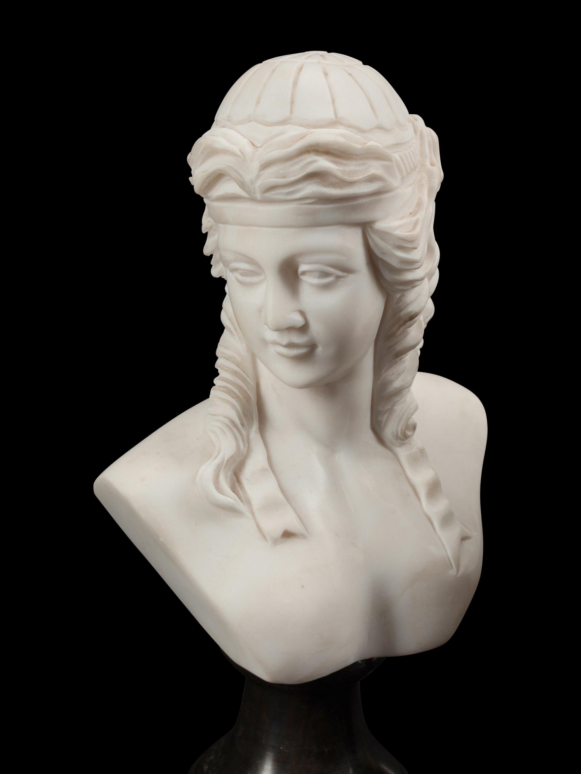 A Set of Four Bi-Color Marble Busts